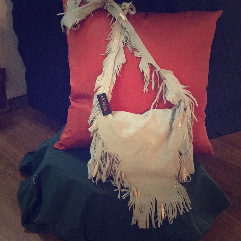 Hand made, vintage lamb skin leather fringe bag.